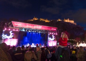 Children and adults enjoying the street party on new year's eve in Edinburgh.